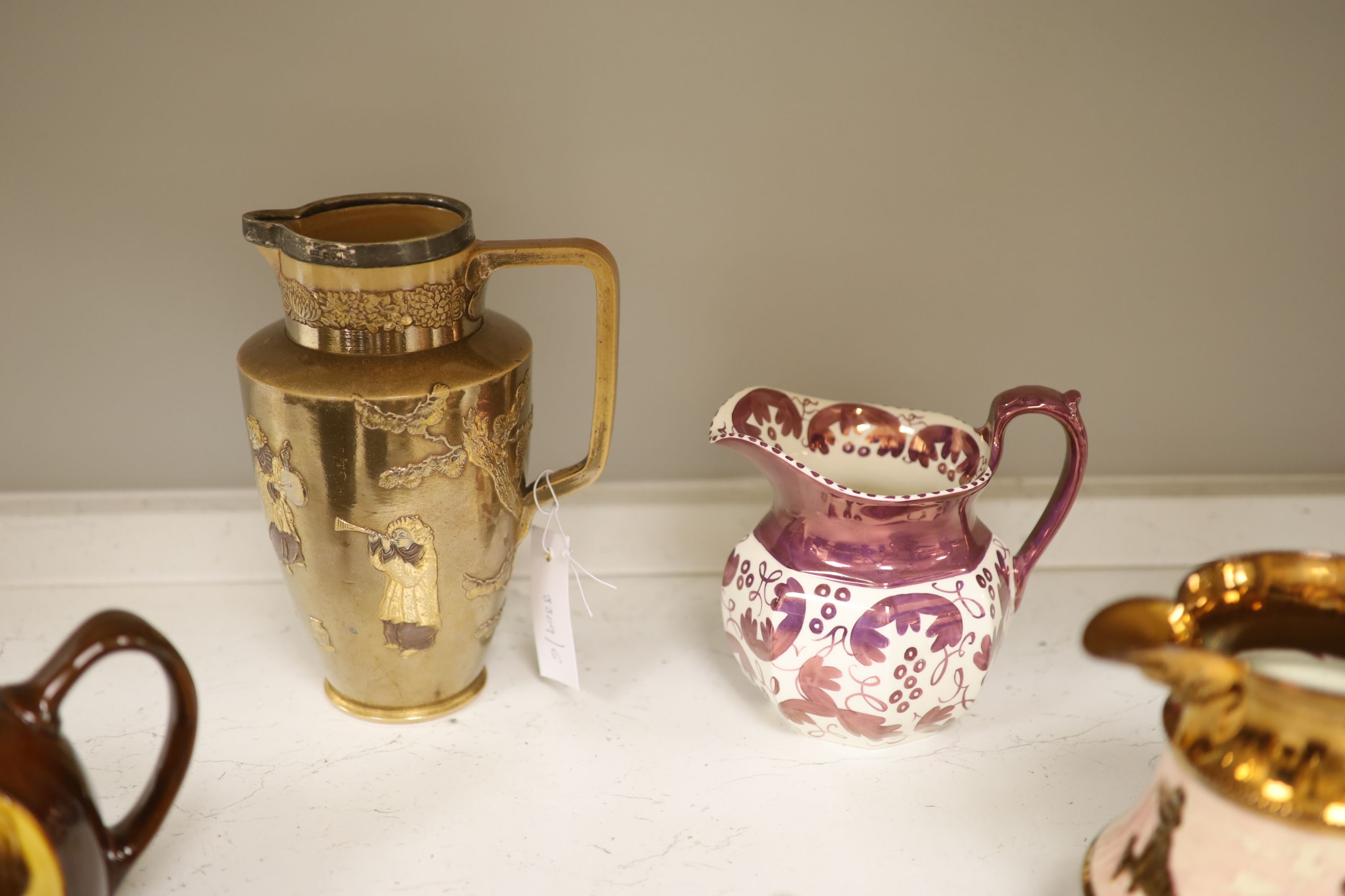 A Royal Doulton silver mounted Hearts Content tea service, and a Doulton Japanese inspired silver mounted jug, assorted lustre jugs